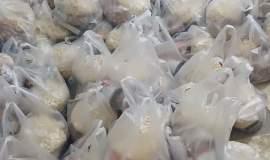 توزیع ۲۰۰ بسته معیشتی و پارچه میان مددجویان اداره یک مشهد